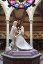Stone sculpture of Princess Aurora and Prince Phillip dancing