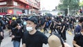 Protests in Hong Kong October 2019 Riot police bunch up next to a cloud of tear gas during clashes withg Battles in Hong Kong 2019