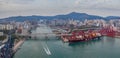 Hong Kong, China - 2020: Rambler Channel, bridges and ship with containers