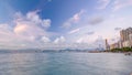 Hong Kong, China skyline panorama day to night from across Victoria Harbor timelapse.