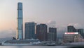 Hong Kong, China skyline panorama with skyscrapers from across Victoria Harbor evening timelapse.