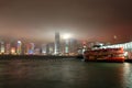 Victoria Harbour at night with low clouds level Royalty Free Stock Photo