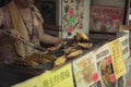 Hong Kong, China - Woman cooking street food