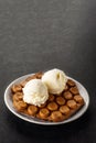 Hong Kong chocolate bubble waffle with ice cream on dark background with copy space.