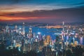 Hong Kong city on dramatic sky at sunset view from mountain Royalty Free Stock Photo