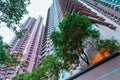 Hong Kong city high-rise residential district in the evening. Scenic upward landscape of high skyscraper buildings. Royalty Free Stock Photo