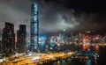 Hong Kong cityscape at night, skyscrapers and tall buildings at Victoria Harbour, drone aerial view Royalty Free Stock Photo