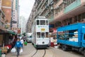 Double-decker trams. Double-deck electric tram moving on the street of Hong Kong.