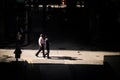 Businessmen walks across a small junction in the back alley of Hong Kong