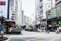 Hong Kong - December 11, 2016: View of Hong Kong road traffic and people against with the commercial buildings in Kowloon side of