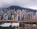 Hong Kong Downtown with clouds in storm. Dramatic sky with raining. Financial district and business centers. Skyscraper and Royalty Free Stock Photo