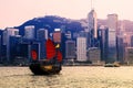 Hong Kong cityscape at Victoria Harbour and Tourist junk boat Royalty Free Stock Photo