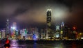 Hong Kong Harbour, Victoria Bay night scene. The neon lit skyscrapers on a misty cloudy evening.