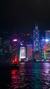 Hong Kong iconic red vintage sail boat sailing at night skyline