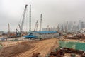 Cranes in the dirt on construction site, Hong Kong Island, China