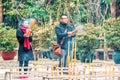 A couple of Chinese tourists have come to Po Lin Monastery on Lantau Island in Hong Kong with their incense offerings to pray and