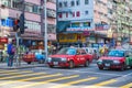 Hong Kong - January 10, 2018 :Red taxi cab stop at pedestrians t Royalty Free Stock Photo