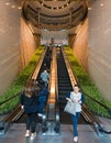 People move on escalators in Two Exchange Square