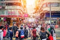 People walking across Road, Causeway Bay in front of a big department store at Daylight. Hong Kong Royalty Free Stock Photo