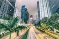 HONG KONG - MAY 4, 2014: City streets and traffic at night. Hong Kong hosts 15 million tourists annually Royalty Free Stock Photo