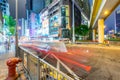 HONG KONG - MAY 4, 2014: City streets and traffic at night. Hong Kong hosts 15 million tourists annually Royalty Free Stock Photo