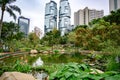 Hong Kong Park with skyscrapers of Lippo Centre in the back. Royalty Free Stock Photo