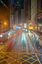 HONG KONG, HONG KONG SAR - NOVEMBER 17, 2018: Light blur motion scene of tram and traffic in central Hong Kong at night. There are Royalty Free Stock Photo