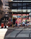 Hong Kong: shoppers at household goods store, man ascending stairs