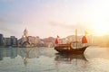 Hong Kong skyline with a traditional boat seen from Kowloon