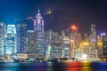 The Hong Kong skyline and Victoria Peak at night, seen from Tsim Sha Tsui, in Kowloon, Hong Kong. Royalty Free Stock Photo