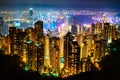 Hong Kong skyscrapers skyline cityscape view from Victoria Peak illuminated in the evening. The most famous view of Hong Kong at Royalty Free Stock Photo