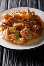 Hong Kong Style Chinese recipe! Crispy battered shrimp tossed in creamy sauce topped with sugar coated walnuts. Vertical Royalty Free Stock Photo