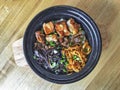 Hong Kong style pork rib beef claypot rice laid out on a wooden board Royalty Free Stock Photo