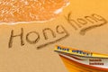 Hong Kong title on the sand beach of the South China sea