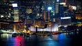 Hong Kong Victoria harbour and its iconic red ancient junk sail zoom shot from the Peak at night Royalty Free Stock Photo