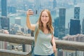 Hong Kong Victoria Peak woman taking selfie stick picture photo Royalty Free Stock Photo