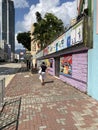 Hong Kong woman walking on sunny street