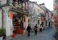 Hongcun Ancient Town in Anhui Province, China. Street with traditional buildings, red lanterns and tourists Royalty Free Stock Photo