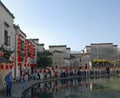 Hongcun Ancient Town in Anhui Province, China. Tourists and old buildings by Moon Pond