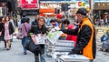 HONGKONG, CHINA - December 9 2016: Distribution of the free newspaper on the road with every morning in Hong Kong