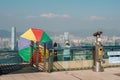 People looking on skyline of HongKong from The Peak observation deck on Peak Tower, the most popular landmark in Hong Kong