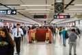 People walking inside Central MTR station / underground subway train station in HongKong