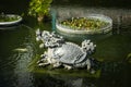 Sculpture inside pond in  Good Wish Garden, Wong Tai Sin Temple in Hong Kong Royalty Free Stock Photo