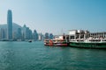 Star Ferry boat on Tsim Sha Tsui Star Ferry Pier and HongKong Island skyline background