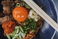 Hongkong style noodle with fresh raw egg and some vegetables. Royalty Free Stock Photo