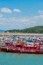 Row of fishing boats docked at concrete pier at Namhang port Royalty Free Stock Photo