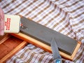 Honing oil being applied to a sharpening stone