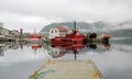 Norway - Honningsvag Harbour - Colored fishing boats with fog Royalty Free Stock Photo