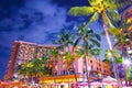 Hotel city and palm trees at night Royalty Free Stock Photo