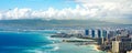 Honolulu Coastline with an Airplane Flying Royalty Free Stock Photo